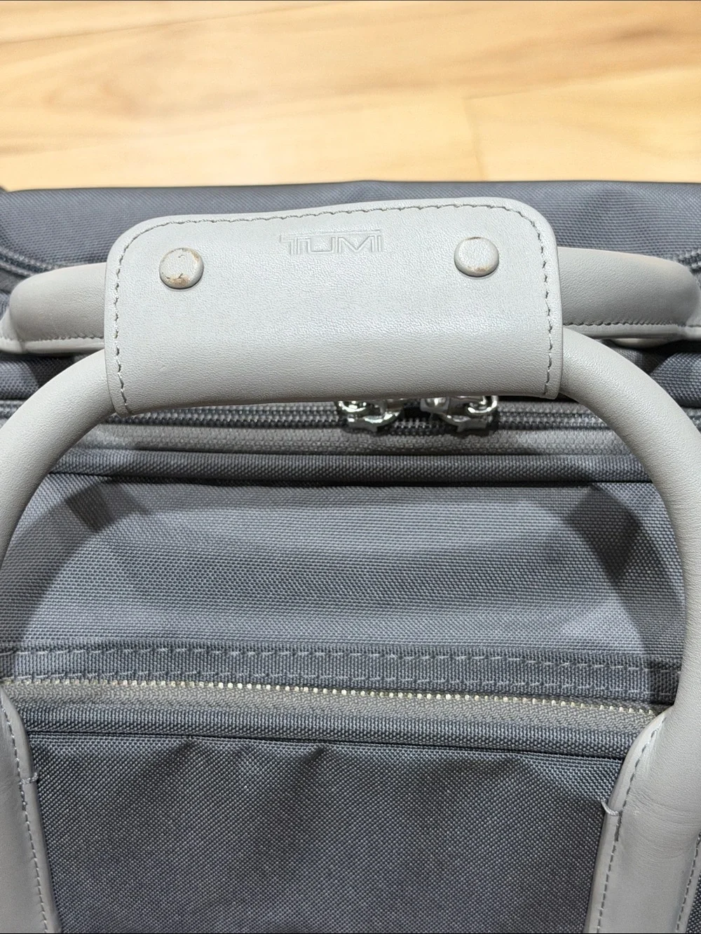 Tumi Navy and Light Gray Travel Carry On Roller Bag - Sleek Front Pouch